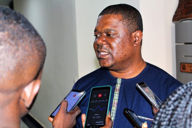Prof Cyrille Ndo talking to the press
