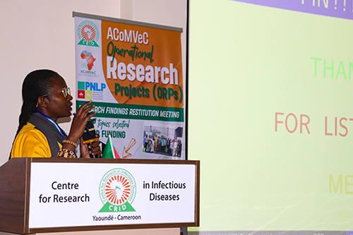 Dr. Djouda Bilyole presenting her analysis of the cost-effectiveness of IRS versus ITNs 